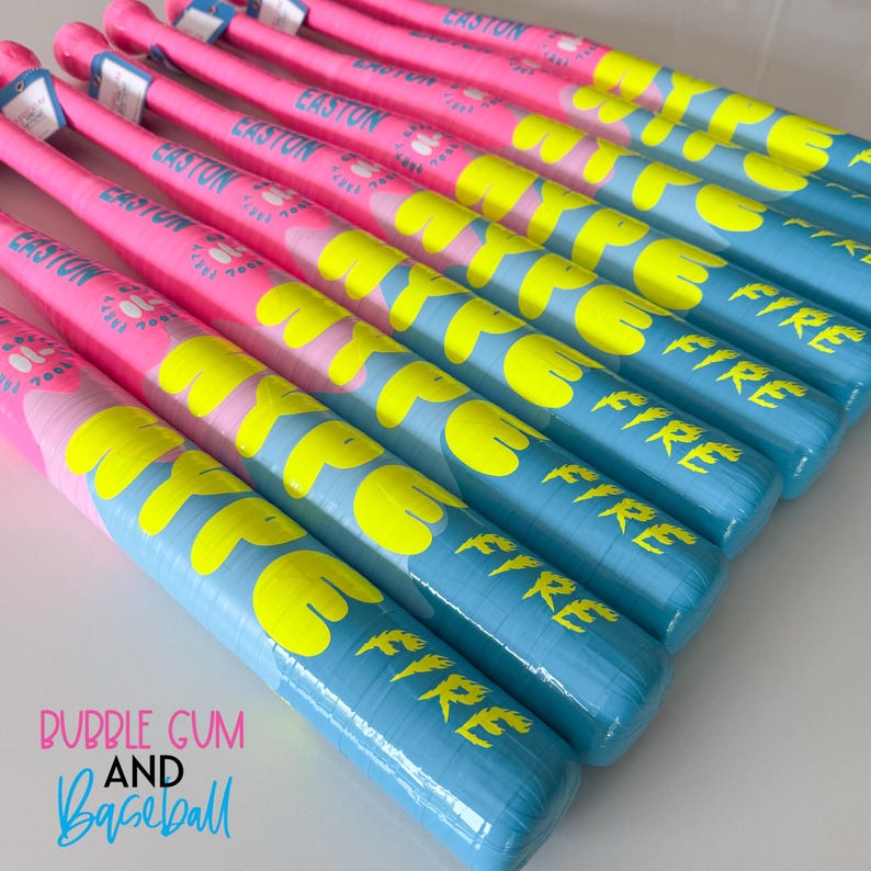 May include: A selection of baseball bats, arranged in a row, featuring a striking colour palette. The bats alternate between pink and blue, with yellow lettering that spells "HYPE FIRE". The text "BUBBLE GUM AND Baseball" is also visible.