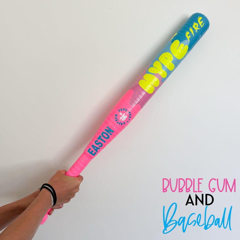 May include: A pink and blue baseball bat with the text "HYPE FIRE" in yellow. The bat has the word "EASTON" in blue on the pink handle. The image also includes the text "BUBBLE GUM AND Baseball".