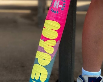 May include: A bright pink, yellow, and blue baseball bat featuring the text "HYPE FIRE" in large yellow letters. The bat includes a circular logo with the text "LIMITED EDITION" and "2008" printed in white, along with small flame icons.