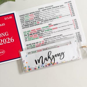 Mahjong-Linienleser, Shaker-Linienleser mit Konfetti im Inneren. Kann auch als Lesezeichen verwendet werden, Mahjong-Lesezeichen. Bild 2