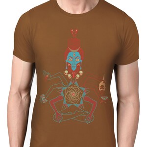 May include: A brown t-shirt with a colorful illustration of a deity with multiple arms and a third eye. The deity is sitting in a meditative pose with a geometric pattern behind them.