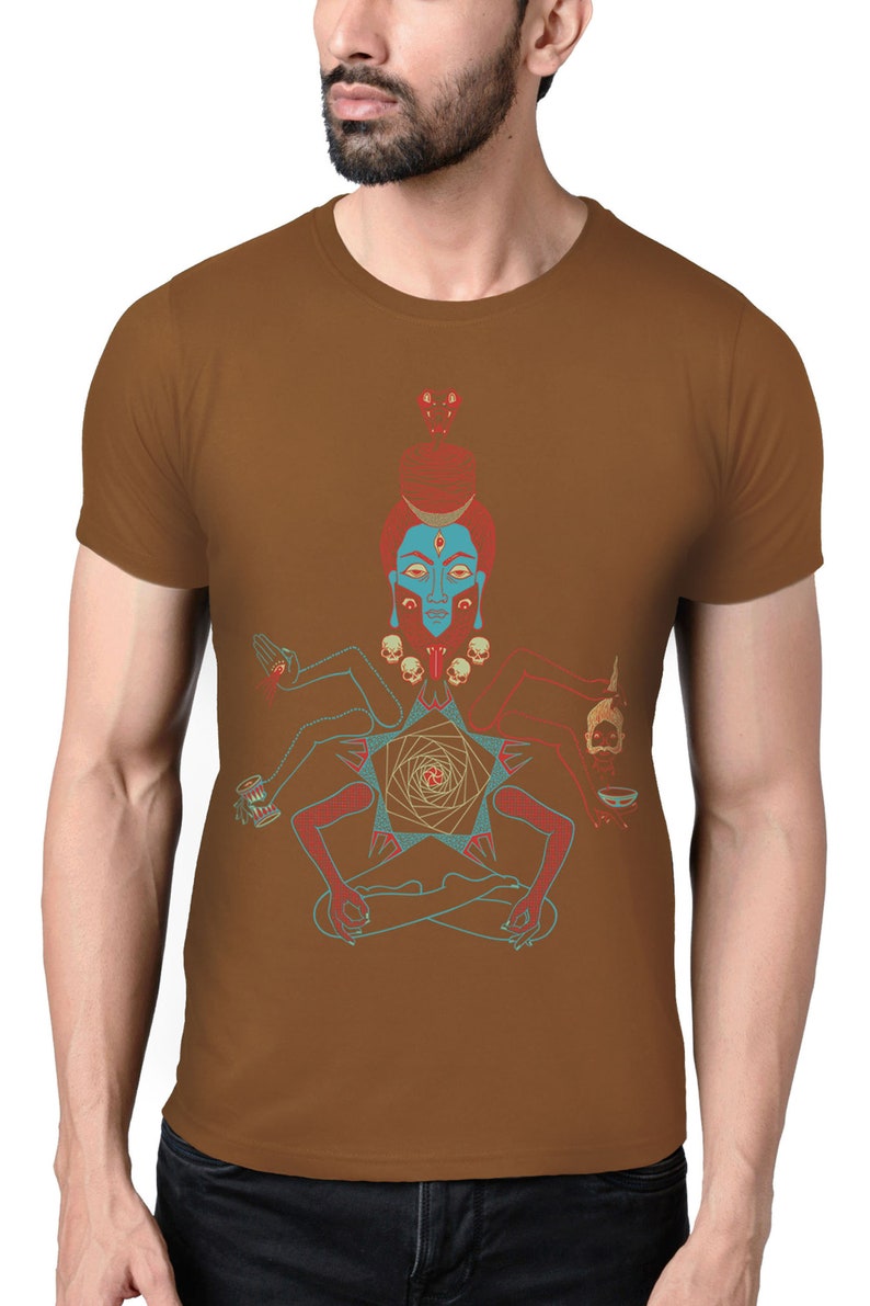 May include: A brown t-shirt with a colorful illustration of a deity with multiple arms and a third eye. The deity is sitting in a meditative pose with a geometric pattern behind them.