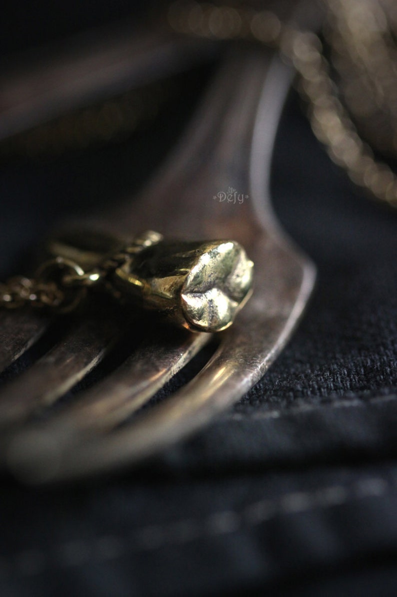 A Tooth Charm Necklace by Defy Original Brass Handmade Jewelry