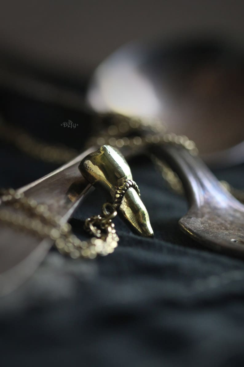 A Tooth Charm Necklace by Defy Original Brass Handmade Jewelry