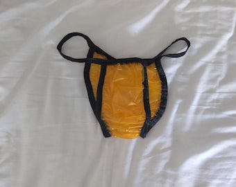 Waterproof orange plastic unisex bikini/panties (26-41)