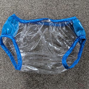 Calça impermeável transparente de vidro/plástico grosso azul claro (29-47)