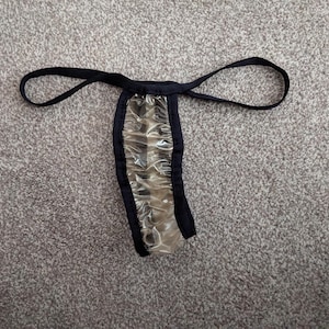 Firm gold glittery plastic thong (27-47)