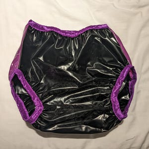 Vattentäta tjocka svarta/ogenomskinliga lila plastbyxor (22-36)