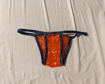 Waterproof red plastic bikini styled panties (29-44)