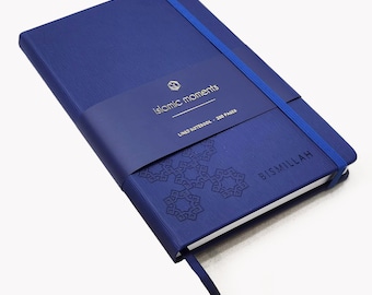 May include: A blue lined notebook with a gold elastic closure and the words "islamic moments" and "Bismillah" printed on the cover.