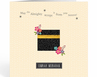 May include: A card with a black and gold illustration of the Kaaba, a cube-shaped building in Mecca, Saudi Arabia. The card has a white background with a pattern of small white dots. The text "May the Almighty accept it from you Ameen!" is written in black text on the card. The text "UMRAH MUBARAK" is written in black text on a white rectangle at the bottom of the card.