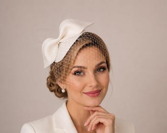 Ivory Bridal Fascinator Hat – Sculptural Bow, Birdcage Veil, Wedding Headpiece