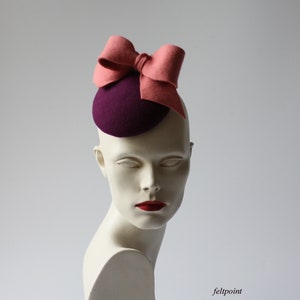 Sweet Bibi hat.  Purple fascinator with powder pink bow