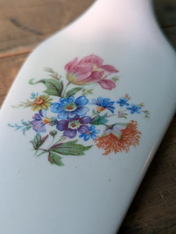Vintage white ceramic cake slice with a floral pattern. ***R120*** #vintagesouthafrica