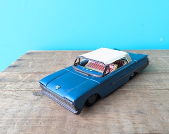 Vintage Tin Friction 1960 Ford Sedan, Made in Japan by Taiyo 6 1/2" long x 2 1/2" wide x 2" tall