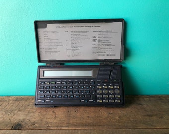 Calcolatrice programmabile Texas Instruments TI-74 Basicalc vintage 1985, PC-324 non testata