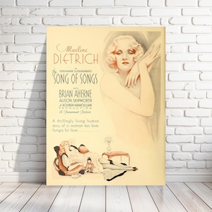 May include: A vintage movie poster for the film "The Song of Songs" starring Marlene Dietrich. The poster features a portrait of Dietrich in a glamorous pose, with the film's title and credits printed in a bold, stylized font.