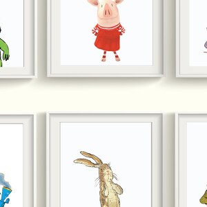 May include: A collection of framed illustrations featuring various characters, including a green crocodile, a pink pig, a mouse wearing a crown, a blue train, a brown rabbit, and two frogs riding a bicycle.