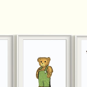 May include: Three framed illustrations of a yellow dog, a brown teddy bear wearing green overalls, and a large gray robot.
