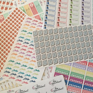 May include: Assortment of colorful planner stickers featuring various designs, including basketballs, running figures, hair appointment reminders, prayer request labels, and "Back to School" themed stickers.