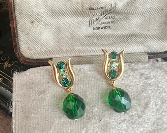 Vintage emerald and peridot set in attractive design with emerald multi-faceted glass bead.