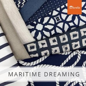May include: A collection of fabric swatches in various navy blue and white patterns, including stripes, geometric designs, and rope patterns. The swatches are arranged in a stack, with the top swatch featuring the text "sunbrella". The text "MARITIME DREAMING" is displayed at the bottom of the image.