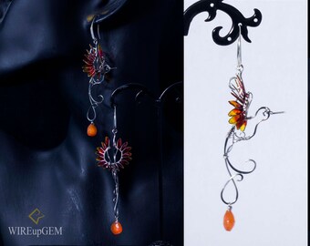 Stainless Steel bird earrings with epoxy element and carnelian teardrop.