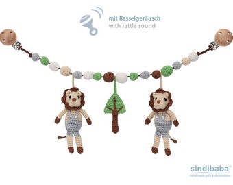 Crochet stroller chain with lions and rattles