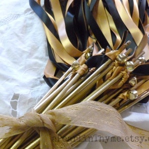 Elegant Weddings is the Style for Your Wedding! Old World Gold and Black Ribbons with Shimmery Gold Wands