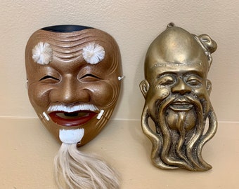 Vintage pair of Confucius Masks One is Terracotta and One Solid Brass Wall Decorations Eastern Asian Art