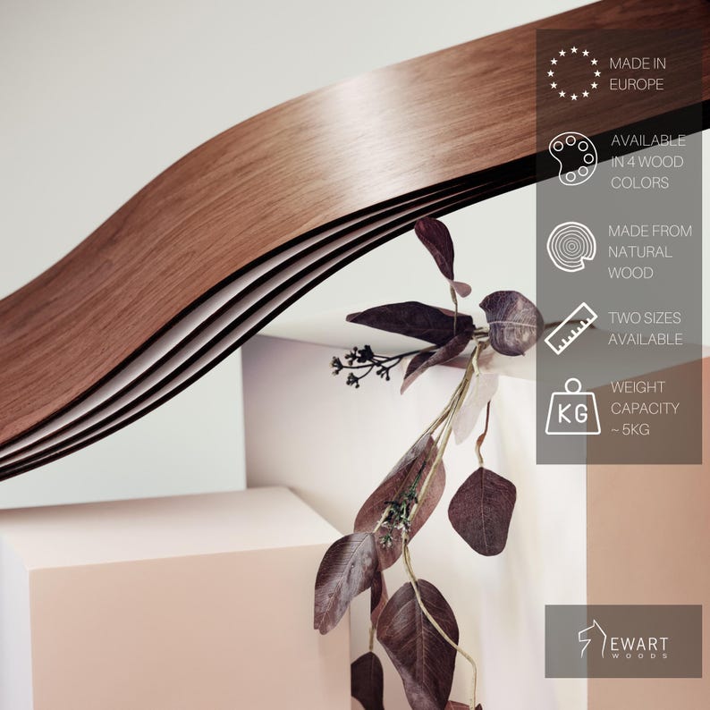 May include: A wooden, wavy design element in shades of brown. The product is made from natural wood and available in two sizes. The weight capacity is approximately 5 kg. The text on the image says "Made in Europe" and "Available in 4 wood colors."
