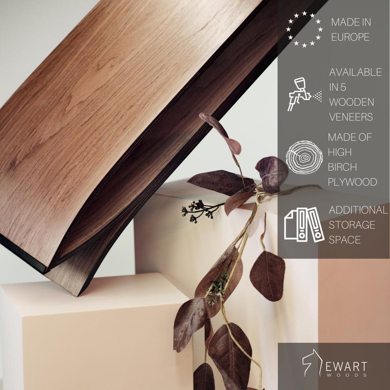 May include: A wooden shelf with a natural grain finish, displayed alongside text stating Made in Europe, available in 5 wooden veneers, made of high birch plywood, and additional storage space, with the Ewart Woods logo at the bottom.
