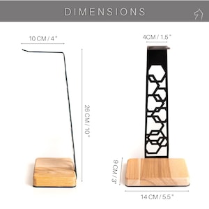 The image shows the dimensions of the headphone stand in centimeters. It has a height of 26 cm, a base width of 14 cm, and a depth of 10 cm. The steel frame has a width of 4 cm, while the wooden base is 9 cm tall.