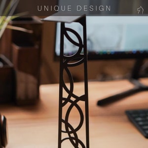 Stylish headphone stand with a distinctive cutout design. Made from durable steel and natural wood.