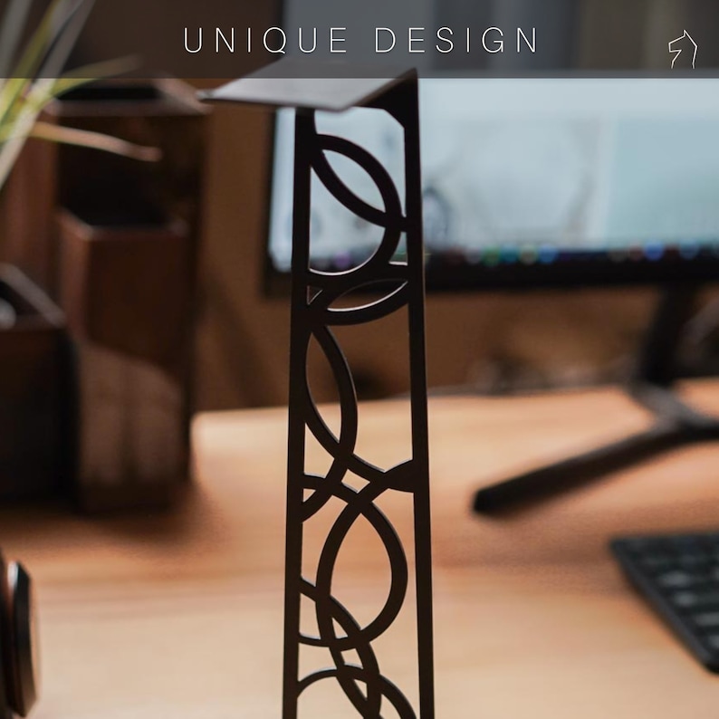 Stylish headphone stand with a distinctive cutout design. Made from durable steel and natural wood.