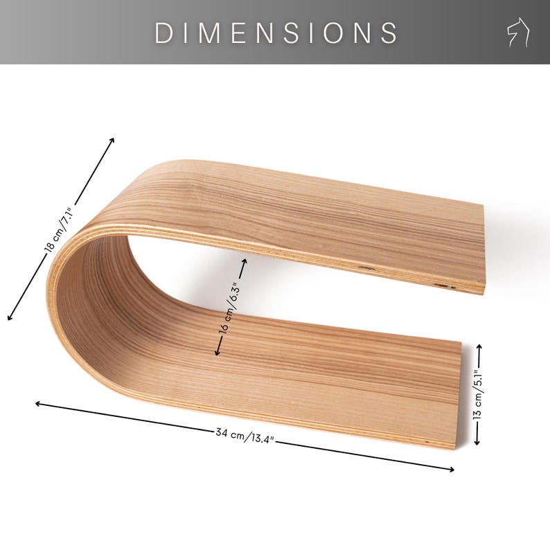 May include: A curved wooden shelf with dimensions labeled. The shelf is 13.4 inches long, 7.1 inches high, and 6.3 inches wide. The wood has a light brown color and a visible grain pattern. The word "DIMENSIONS" is at the top.