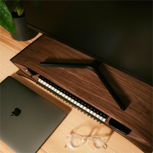 desktop riser from the top view ontable with laptop and other accessories visible