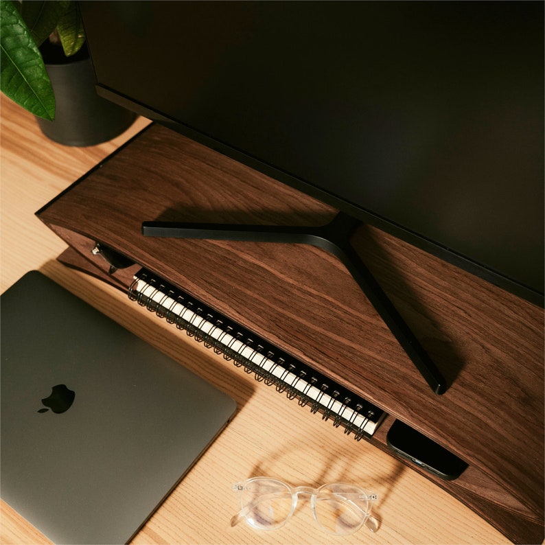 desktop riser from the top view ontable with laptop and other accessories visible
