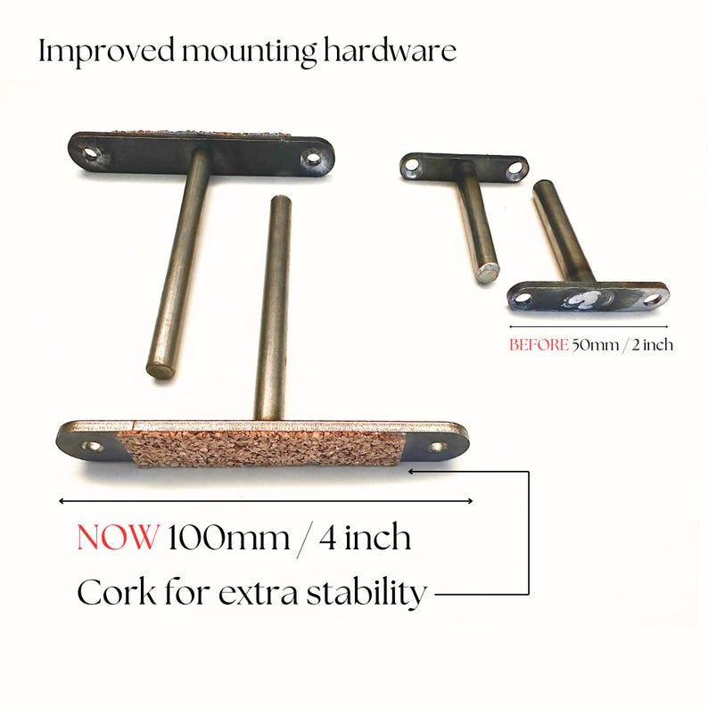 May include: Metal shelf brackets with cork for extra stability. The brackets are T-shaped with a rectangular base and a cylindrical support. The text reads "Improved mounting hardware" and "NOW 4 inch".