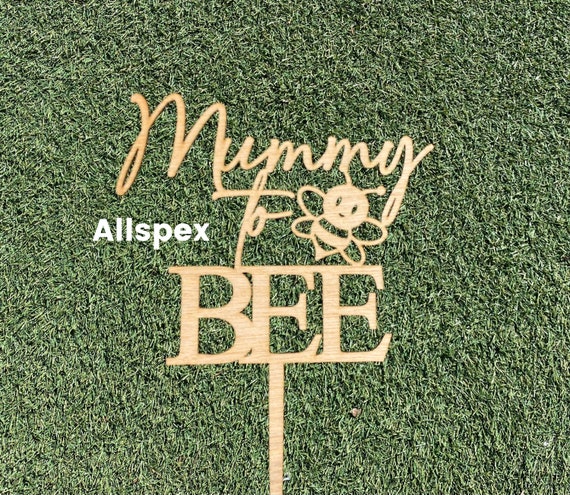 Baby Shower Cake topper reads Mummy to  Bee