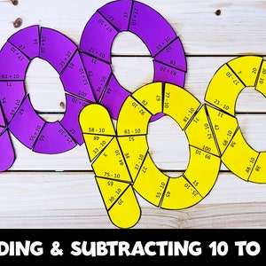 May include: Purple and yellow paper circles with numbers and math equations for adding and subtracting 10 to 100. The circles are cut into puzzle pieces.
