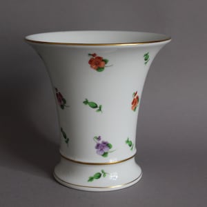 May include: White porcelain vase with a flared top and a gold rim. The vase is decorated with colorful floral patterns in red, purple, and green. The base also has a gold rim. A decorative piece for the home.