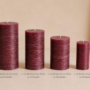 May include: Four cylindrical burgundy candles with a textured, bark-like surface and a single white wick each. The candles are arranged by height, with dimensions listed as 150mm x 75mm, 130mm x 75mm, 105mm x 75mm, and 90mm x 50mm, indicating burn times.