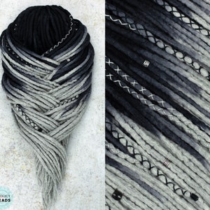 May include: Black and gray ombre synthetic dreadlocks with black stitching and silver beads. The dreadlocks are arranged in a braid pattern.