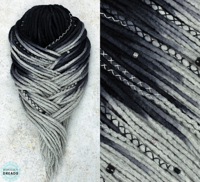 May include: Black and gray ombre synthetic dreadlocks with black stitching and silver beads. The dreadlocks are arranged in a braid pattern.
