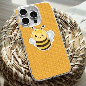 May include: A clear phone case with a yellow honeycomb pattern and a cartoon bee with a smiling face.