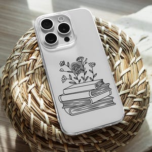 May include: A clear phone case with a black and white illustration of a stack of books and flowers. The phone case is designed for an iPhone.