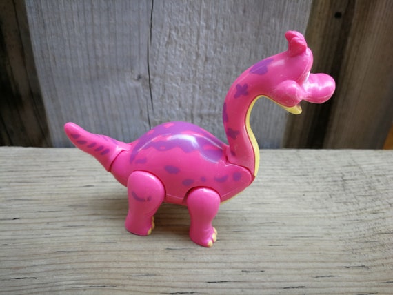 pink plastic dinosaur toy