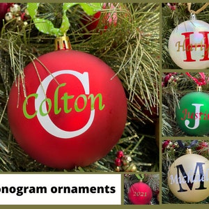 May include: Four Christmas ornaments with personalized names. The ornaments are red, white, green, and gold. The names are Colton, Hartlyn, Justin, and Michael.