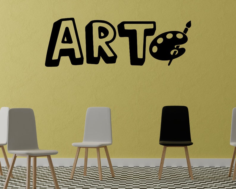 May include: A black and white wall decal with the word "ART" in a playful font and a paint palette with a paintbrush. Three chairs are in the foreground, two white and one black, with wooden legs. The chairs are on a black and white checkered floor.